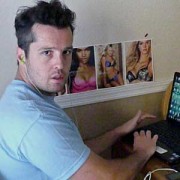 Scruffy young man at a computer